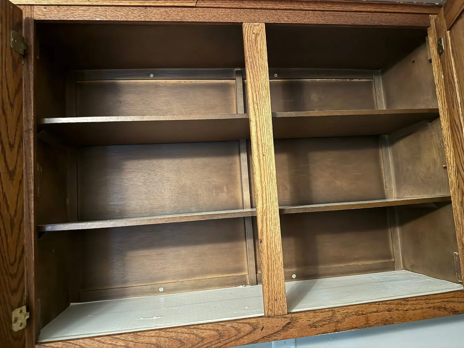 Kitchen cabinet shelves emptied and wiped clean