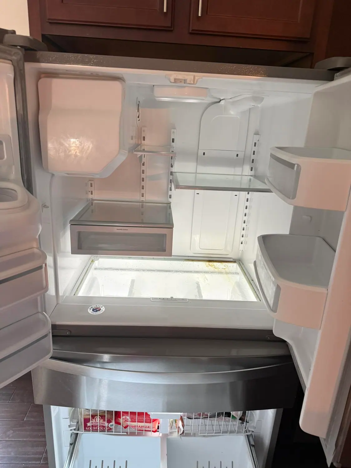 Refrigerator interior emptied and wiped clean
