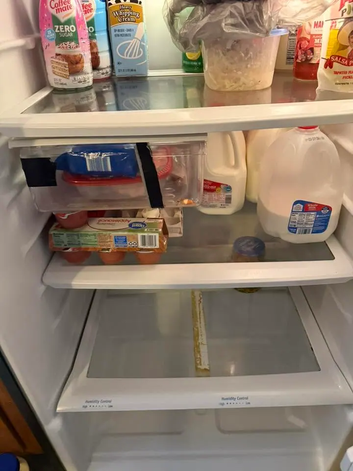 Refrigerator shelves cleaned and groceries reorganized