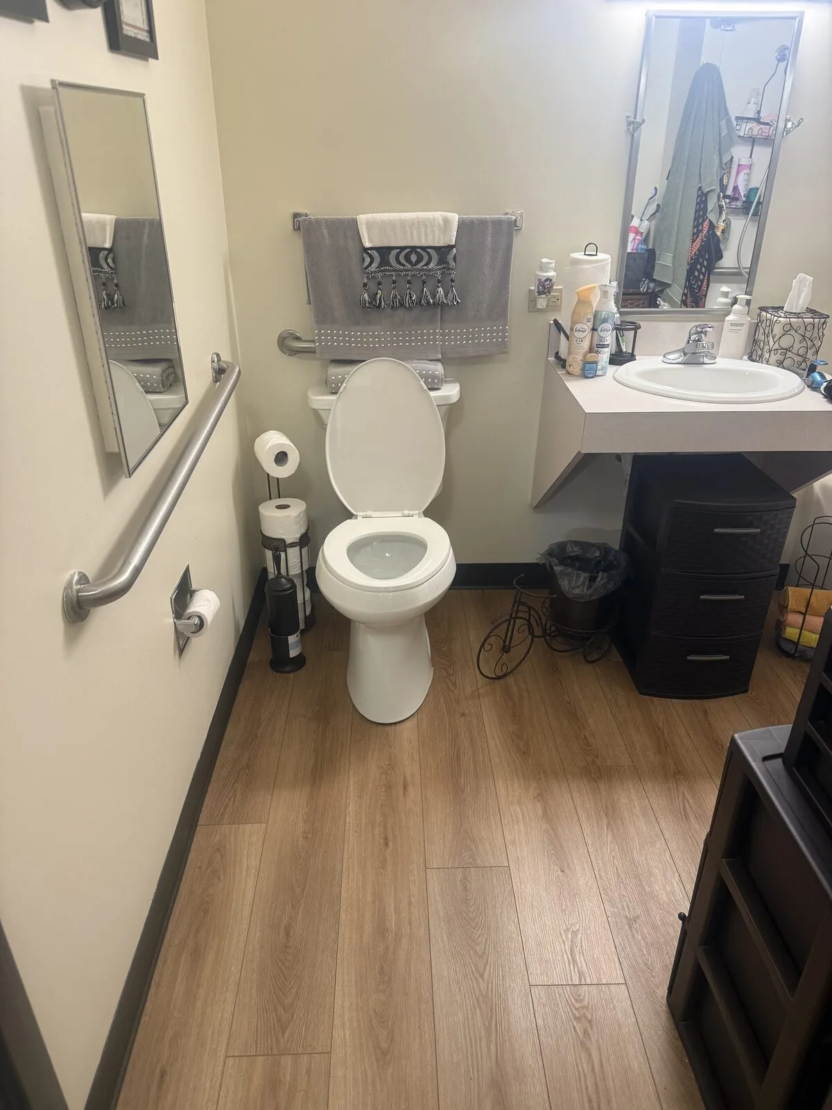 The same bathroom after the visit: toilet, vanity and floors reset