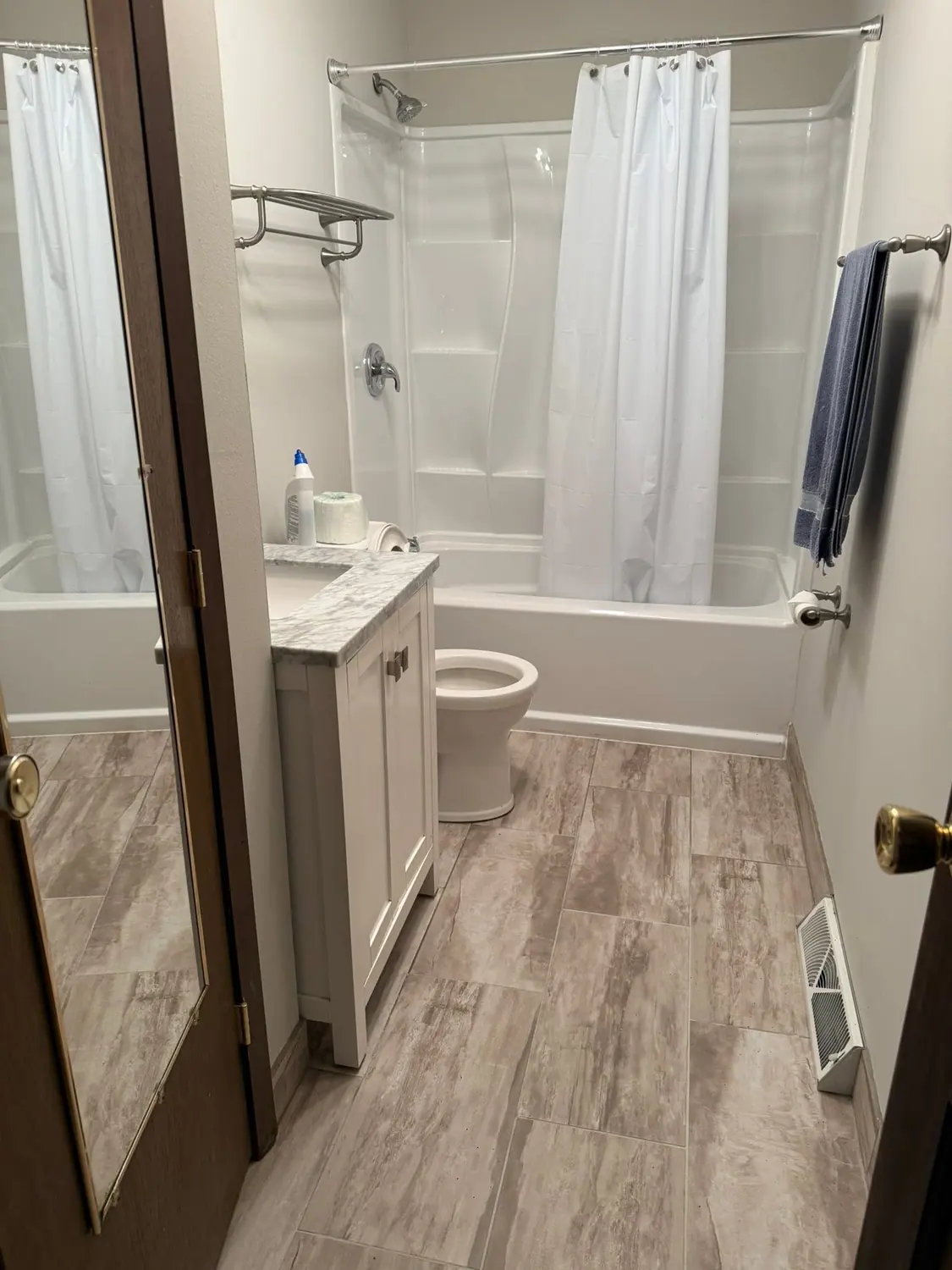 Vanity, tub, and towel bar cleaned in a family bathroom