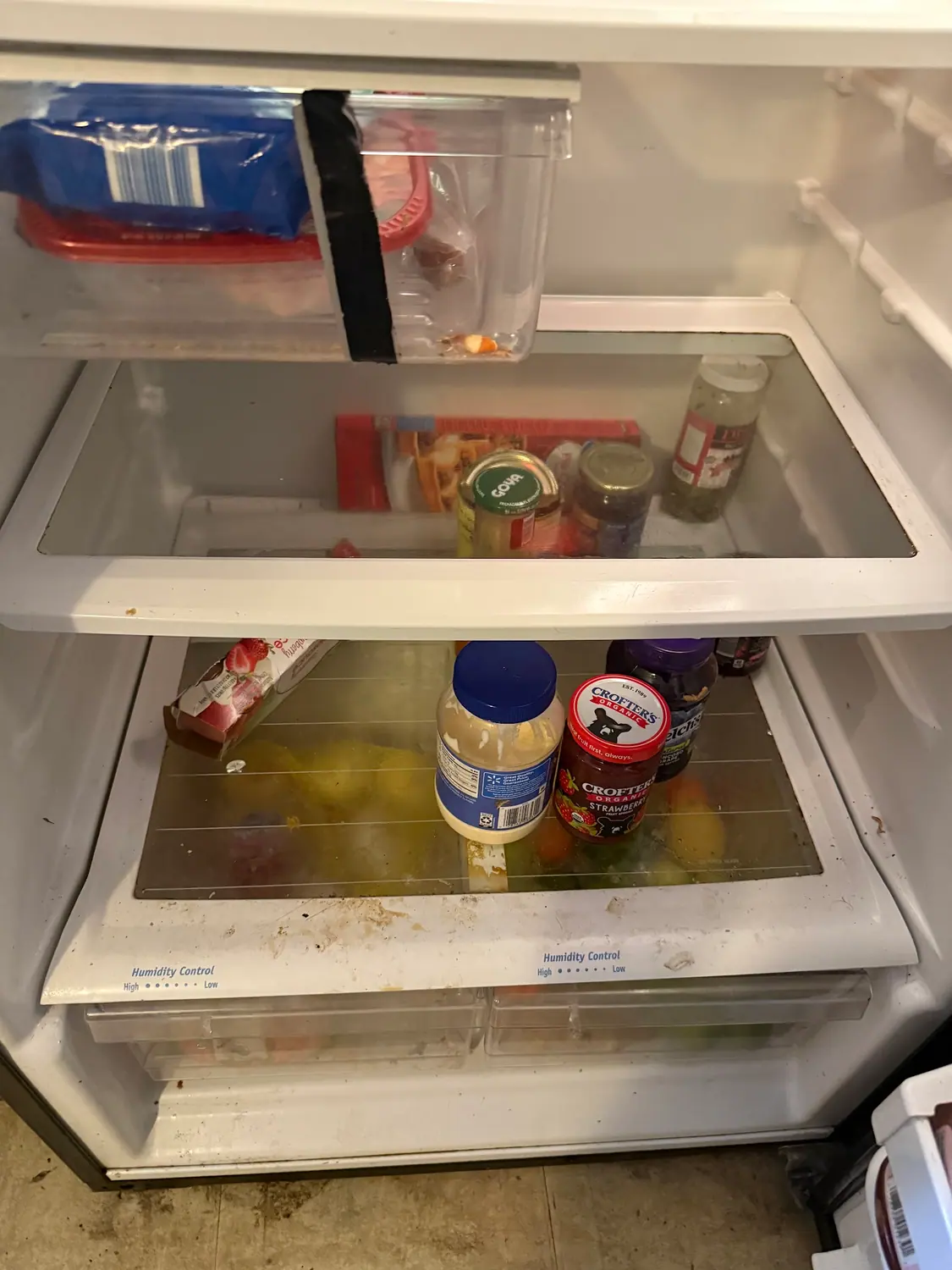 Spills inside a refrigerator before a deep clean