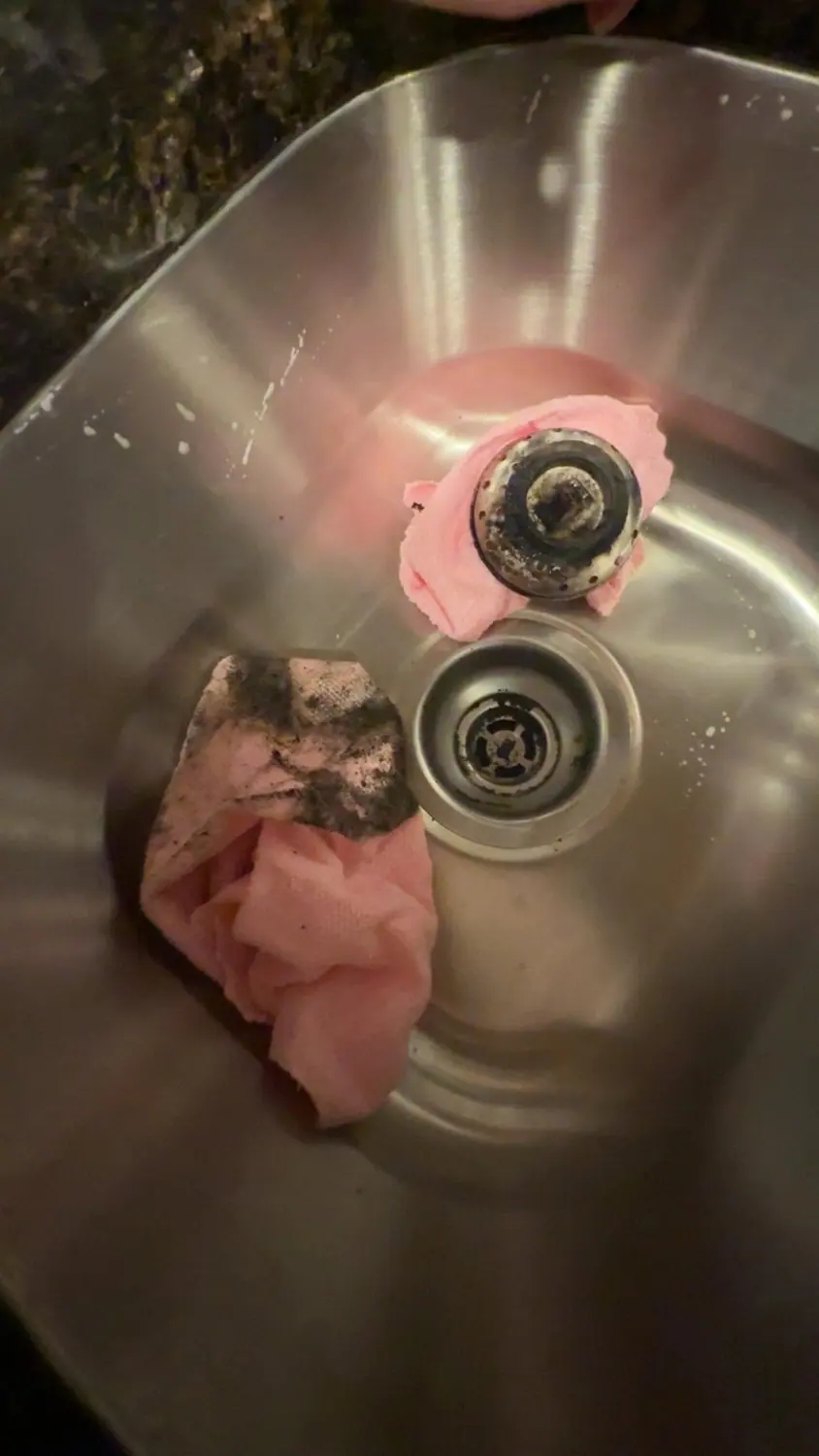 Kitchen sink and drain before scrubbing