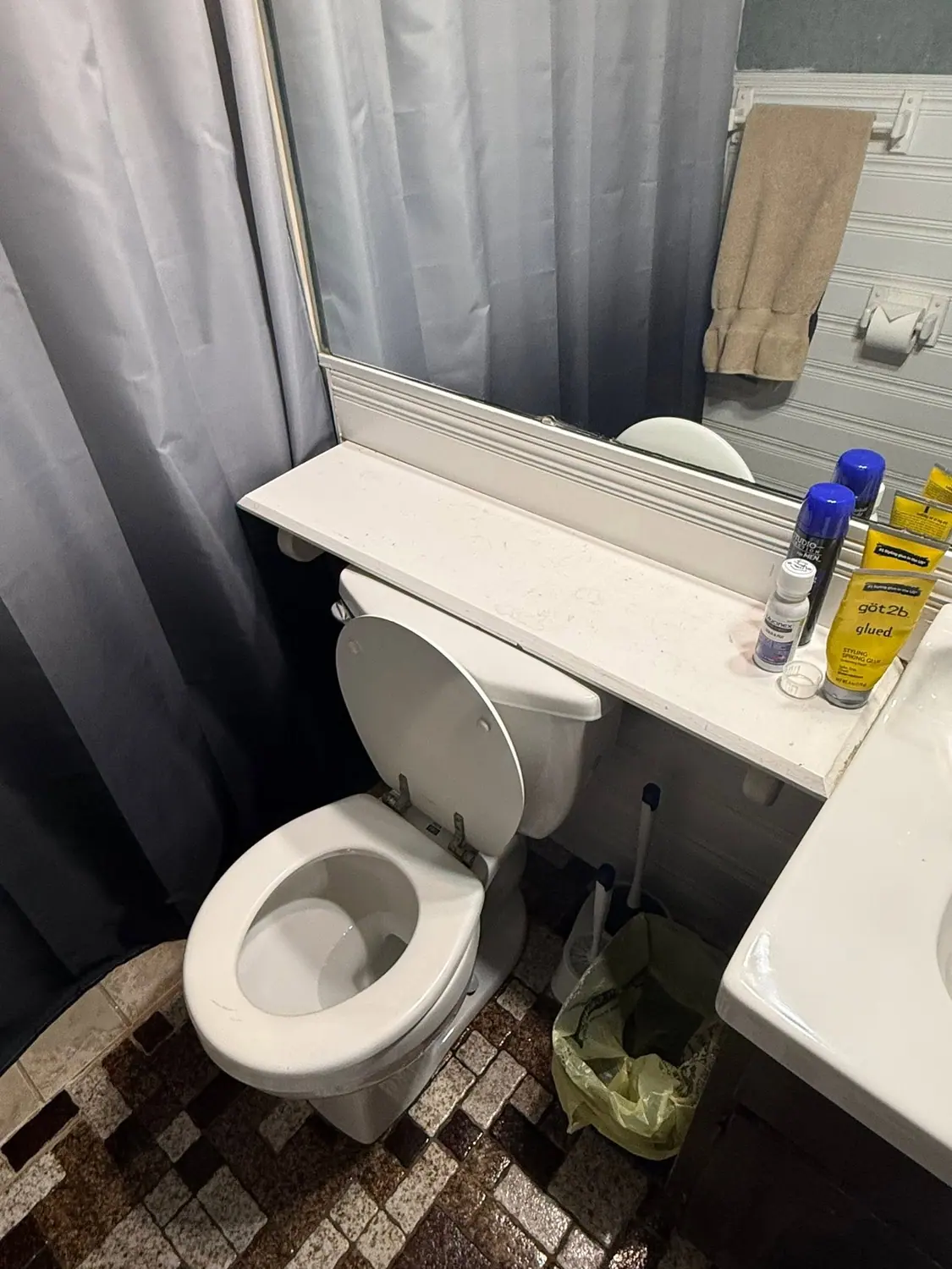 Vanity top cleared and wiped during a bathroom clean