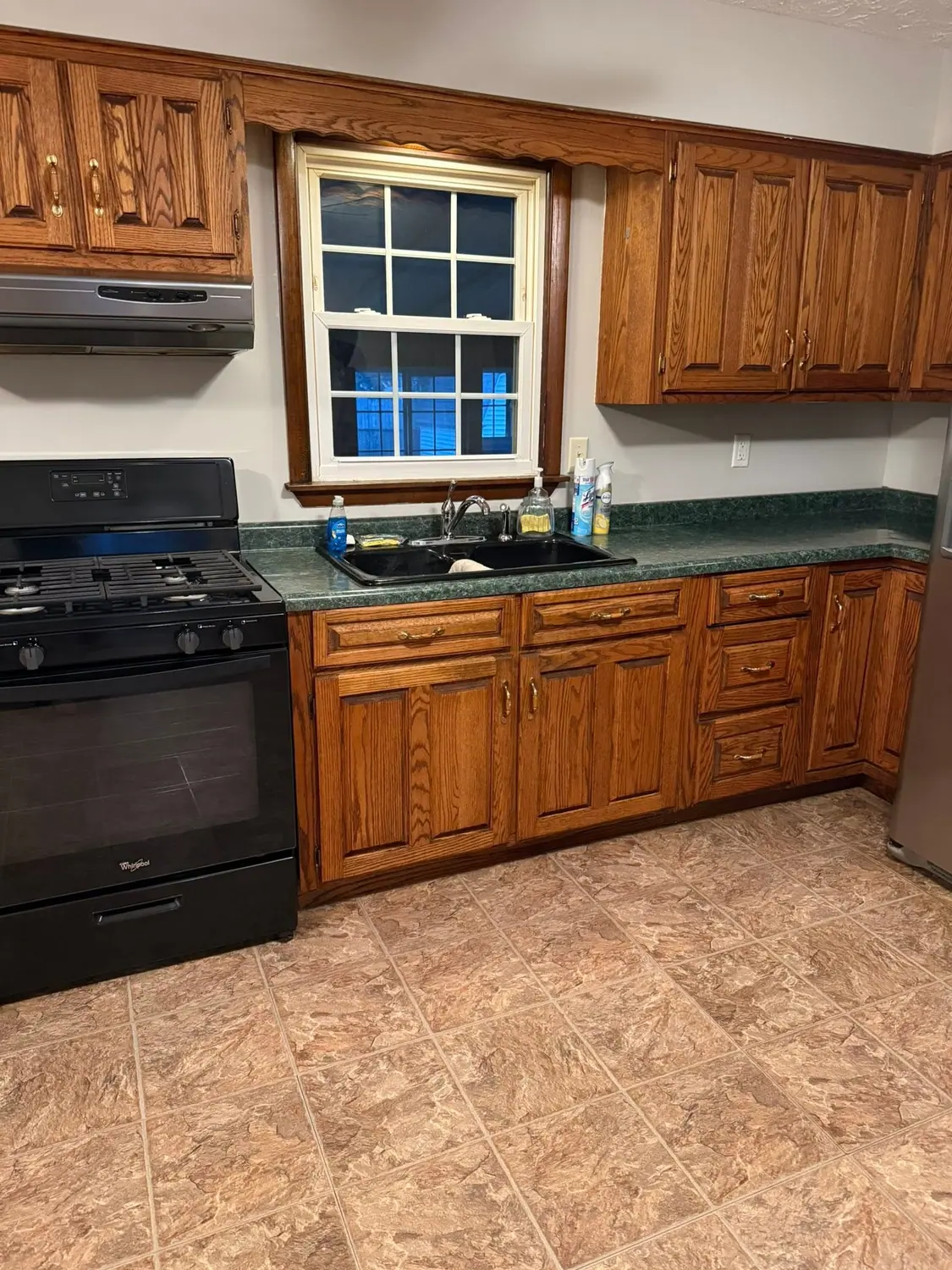 Oak kitchen, stove, and window cleaned top to bottom
