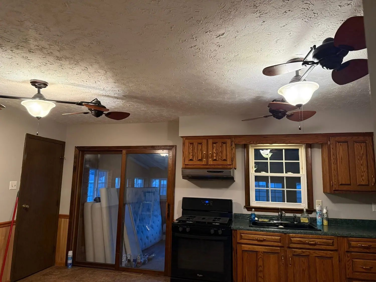 Kitchen, ceiling fan, and window cleaned during a rental turnover