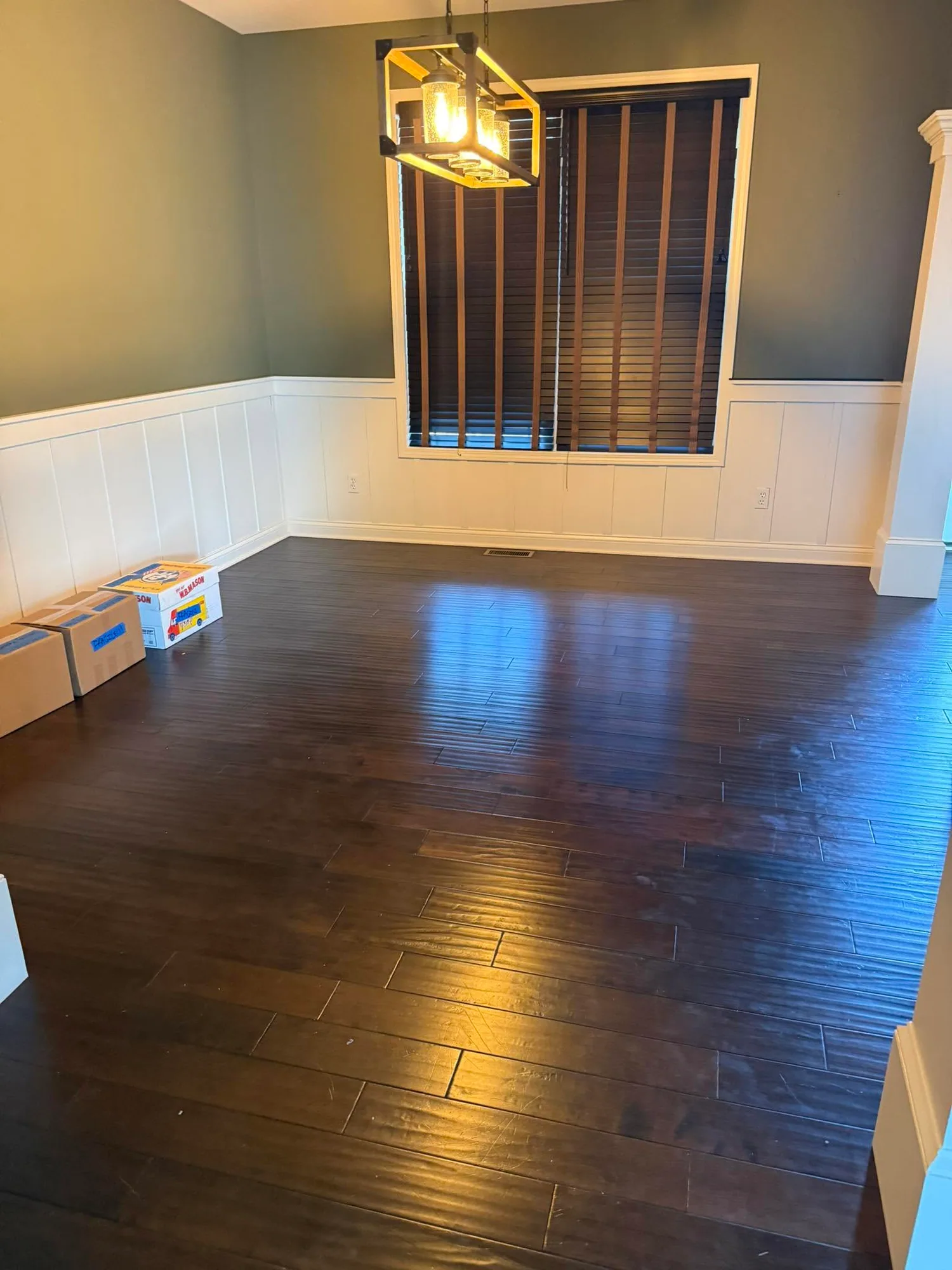 Hardwood floor cleaned to a deep shine in a bright living room