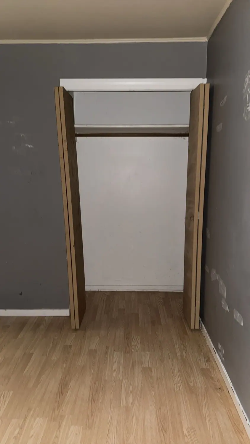 Closet and wall cleaned in an empty bedroom