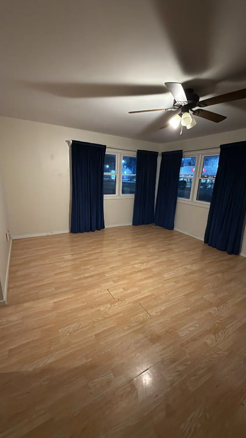 Empty living room cleaned wall to wall and ready for move-in day