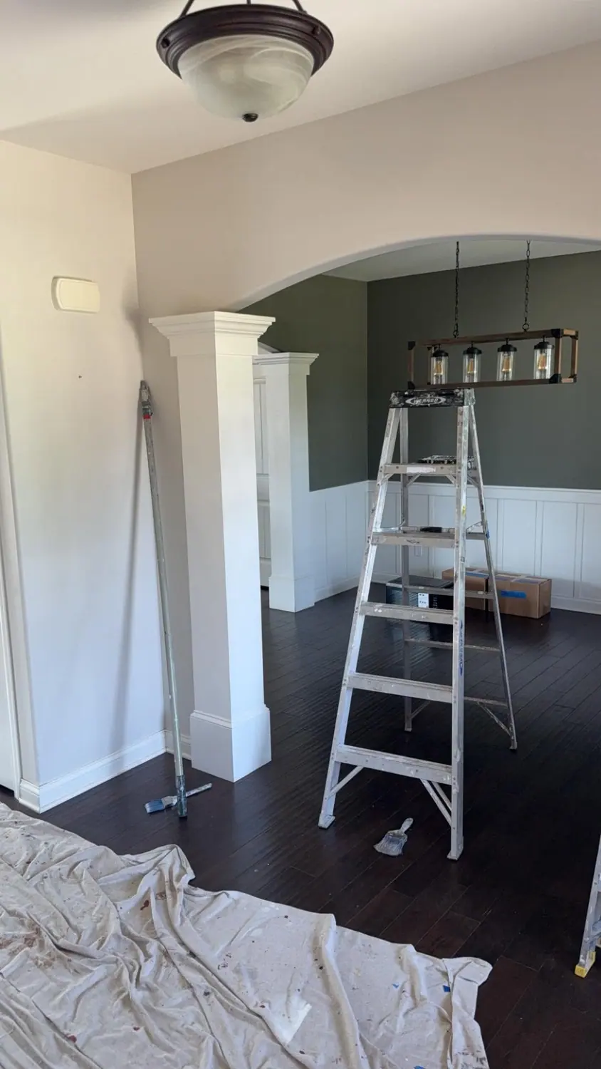 Dark hardwood floor cleaned beneath an arched doorway